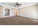 Large main bedroom with ensuite bathroom access and neutral decor at 21391 E Orchard Ln, Queen Creek, AZ 85142