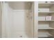 Large shower with shelving and linen closet at 21391 E Orchard Ln, Queen Creek, AZ 85142