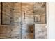 Large walk-in shower with pebble flooring and neutral tile at 21391 E Orchard Ln, Queen Creek, AZ 85142