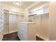 Bright walk-in closet with ample shelving and drawer space at 21391 E Orchard Ln, Queen Creek, AZ 85142