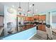 Modern kitchen with dark countertops and stainless steel appliances at 23835 W Gibson Ln, Buckeye, AZ 85326