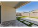 Covered patio, artificial turf, and a small pool at 38124 W Santa Barbara Ave, Maricopa, AZ 85138