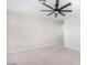 Large bedroom with ceiling fan and access to hallway at 38124 W Santa Barbara Ave, Maricopa, AZ 85138