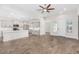 Open concept kitchen with island and stainless steel appliances at 38124 W Santa Barbara Ave, Maricopa, AZ 85138