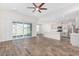 Open concept kitchen with island and stainless steel appliances at 38124 W Santa Barbara Ave, Maricopa, AZ 85138