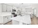 Modern kitchen with large island and stainless steel appliances at 38124 W Santa Barbara Ave, Maricopa, AZ 85138