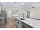 Modern kitchen with large island and stainless steel appliances at 38124 W Santa Barbara Ave, Maricopa, AZ 85138