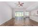 Bright living room with tile floors and sliding glass doors at 38124 W Santa Barbara Ave, Maricopa, AZ 85138