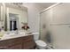 Clean bathroom with single sink vanity, toilet and shower stall at 3949 E Monona Dr, Phoenix, AZ 85050