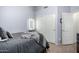 Well-lit bedroom with double doors and a built-in closet at 3949 E Monona Dr, Phoenix, AZ 85050