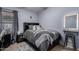 Cozy bedroom with a full-size bed and a vanity area at 3949 E Monona Dr, Phoenix, AZ 85050