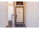 Front entrance with a light beige door and welcome sign at 3949 E Monona Dr, Phoenix, AZ 85050