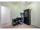 Home office with a desk, chair, and storage cabinet at 3949 E Monona Dr, Phoenix, AZ 85050