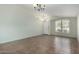 Living room with vaulted ceiling, tile floor, and large window at 3949 E Monona Dr, Phoenix, AZ 85050