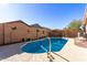 Refreshing kidney-shaped pool with ample surrounding space at 3949 E Monona Dr, Phoenix, AZ 85050