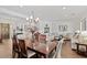 Spacious dining room with hardwood floors and stylish chandelier at 5508 E Barwick Dr, Cave Creek, AZ 85331