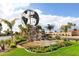 Community entrance with a globe fountain and landscaping at 575 Leisure World --, Mesa, AZ 85206