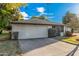 Single story home with landscaped yard and two car garage at 575 Leisure World --, Mesa, AZ 85206