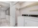 Bright laundry room with washer, dryer, and storage shelves at 575 Leisure World --, Mesa, AZ 85206