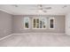 Living room with tile floors, bay window, and ceiling fan at 575 Leisure World --, Mesa, AZ 85206