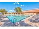 Community pool with ample lounge chairs at 575 Leisure World --, Mesa, AZ 85206