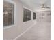 Sunroom with light flooring, ceiling fan and multiple windows at 575 Leisure World --, Mesa, AZ 85206