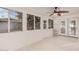 Sunroom with tile floors, ceiling fan and double doors leading outside at 575 Leisure World --, Mesa, AZ 85206