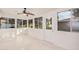 Sunroom with tile floors, ceiling fan and backyard access at 575 Leisure World --, Mesa, AZ 85206