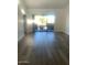 Spacious living area with wood-look floors and access to a balcony at 6480 N 82Nd St # 2203, Scottsdale, AZ 85250
