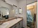Double vanity bathroom with large mirror and shower at 650 N Hawes Rd # 4634, Mesa, AZ 85207