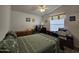 Bedroom with built-in desk, double bed and ceiling fan at 650 N Hawes Rd # 4634, Mesa, AZ 85207