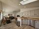 Open concept kitchen with island and views into living room at 650 N Hawes Rd # 4634, Mesa, AZ 85207
