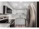 Modern kitchen with stainless steel appliances and white shaker cabinets at 7402 E Carefree Dr # 319, Carefree, AZ 85377