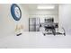 Modern kitchen boasts white cabinets, stainless steel appliances, and a breakfast bar at 7625 E Camelback Rd # A103, Scottsdale, AZ 85251