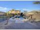 Home's backyard features a sparkling pool and a spacious lawn at 881 E Lynx Way, Chandler, AZ 85249