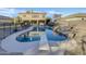 Inviting backyard pool with diving board and a waterfall feature at 881 E Lynx Way, Chandler, AZ 85249