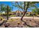 One-story home with desert landscaping and a large driveway at 8821 E Havasupai Dr, Scottsdale, AZ 85255