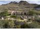 Luxury estate home nestled in the mountains with stunning landscaping and a large pool at 11068 E Canyon Cross Way, Scottsdale, AZ 85255