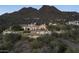 Luxury estate home nestled in the mountains at sunset at 11068 E Canyon Cross Way, Scottsdale, AZ 85255