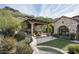 Outdoor patio with seating area and fireplace at 11068 E Canyon Cross Way, Scottsdale, AZ 85255