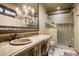 Bathroom with chandelier, vessel sink, and glass shower at 11068 E Canyon Cross Way, Scottsdale, AZ 85255