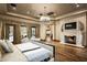 Luxurious Primary bedroom with fireplace and access to backyard patio at 11068 E Canyon Cross Way, Scottsdale, AZ 85255