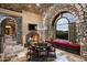 Cozy breakfast nook with stone walls and a charming round table at 11068 E Canyon Cross Way, Scottsdale, AZ 85255