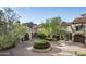 Spacious paved courtyard with central landscaping at 11068 E Canyon Cross Way, Scottsdale, AZ 85255