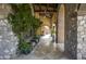 Stone walkway with arched entryways and plants at 11068 E Canyon Cross Way, Scottsdale, AZ 85255