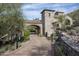 Stone arch entry gate to private estate with landscaping at 11068 E Canyon Cross Way, Scottsdale, AZ 85255