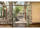 Open french doors to a courtyard with fountain at 11068 E Canyon Cross Way, Scottsdale, AZ 85255
