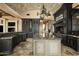 Luxurious kitchen with dark wood cabinets and granite island at 11068 E Canyon Cross Way, Scottsdale, AZ 85255