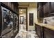 Modern laundry room with ample storage and counter space at 11068 E Canyon Cross Way, Scottsdale, AZ 85255
