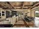 Relaxing living room with open floor plan and a stone fireplace at 11068 E Canyon Cross Way, Scottsdale, AZ 85255